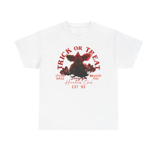 Stylish unisex white t-shirt showcasing a captivating graphic featuring the Demogorgon, complemented by 'TRICK OR TREAT', and retro-themed phrases, ideal for fans of the iconic series and perfect for casual outings.