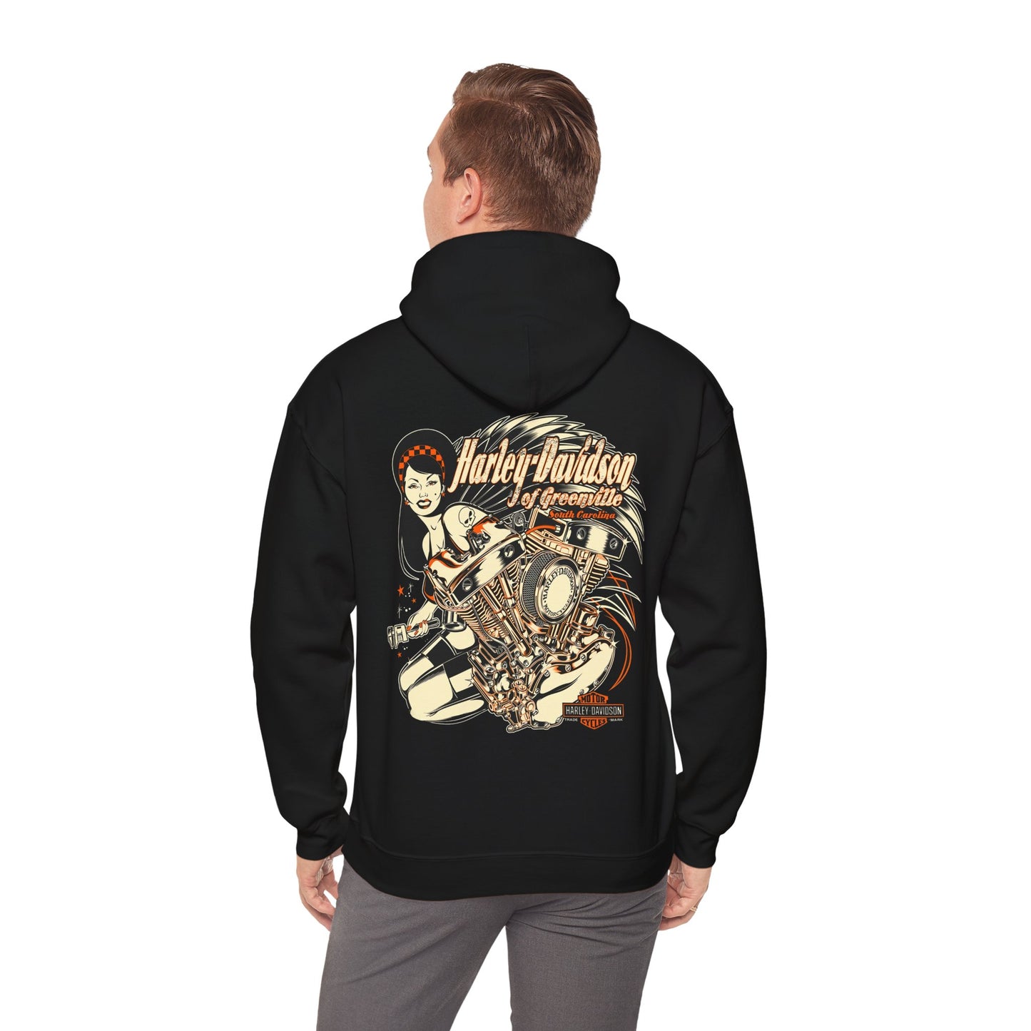 Man wearing a black Harley-Davidson hoodie with a captivating engine and chic lady graphic on the back, exuding confidence and style.