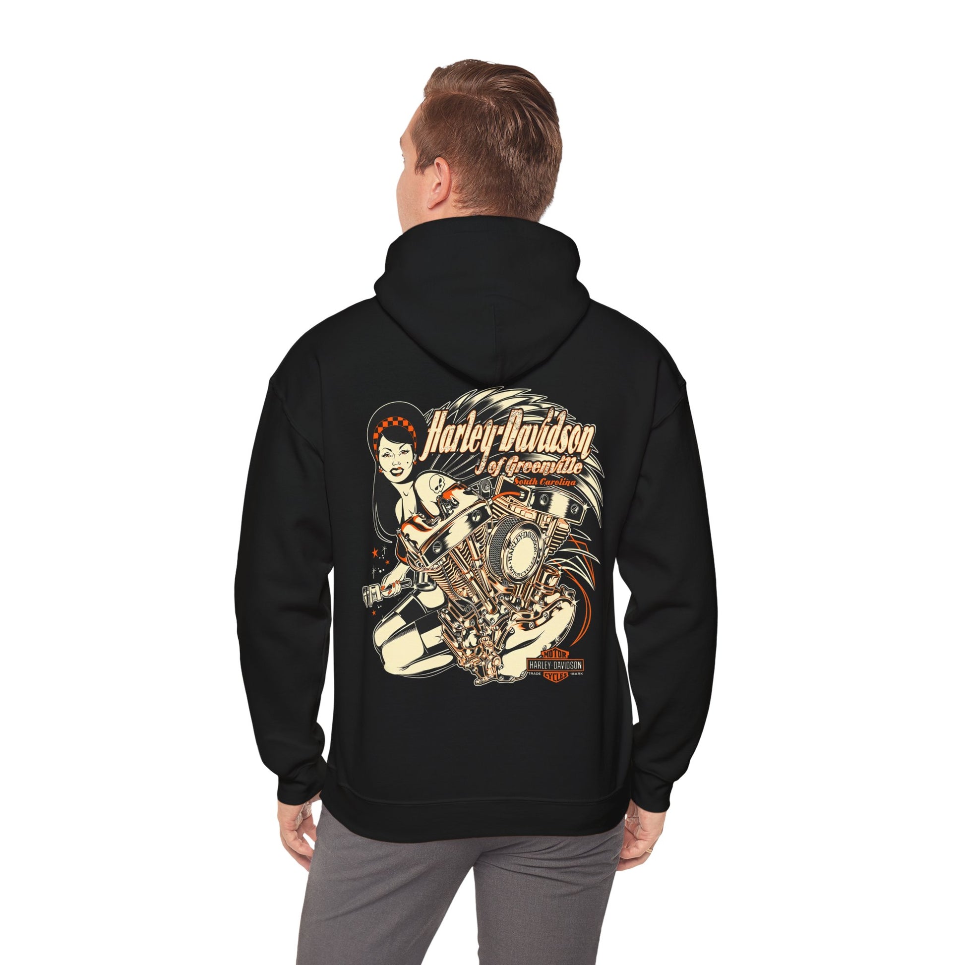 Man wearing a black Harley-Davidson hoodie with a captivating engine and chic lady graphic on the back, exuding confidence and style.