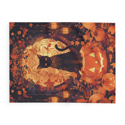 Luxury Decorative and Warm Halloween Spooky Arctic Fleece Blanket highlighting an artistically rendered black cat perched on a jack-o'-lantern, enhanced by autumnal decorations.