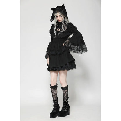 Stylish model wearing the Dark In Love Arya Gothic Lace Doll Dress with cat ear bonnet, embodying a whimsical and edgy Lolita fashion aesthetic.