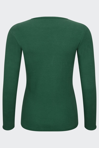 Stylish family in matching forest green pyjamas from DreamBuy, showcasing a trendy and minimalist design perfect for festive occasions.