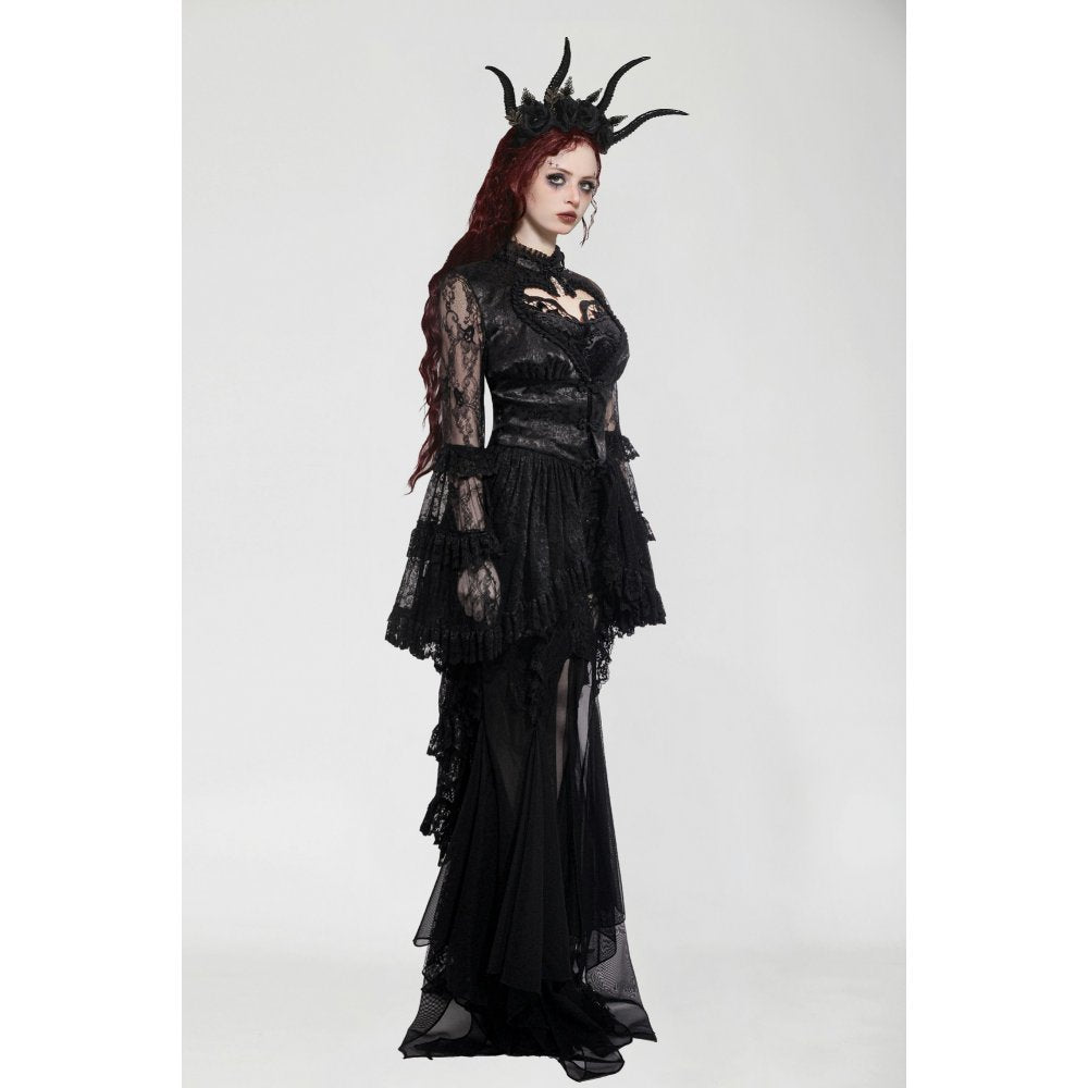Model wearing the gothic tailcoat in an elegant pose, highlighting the romantic silhouette and dramatic features of the design.