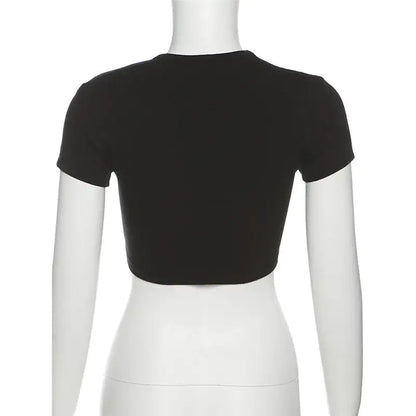 A little girl wearing the stylish Drama Queen Star Graphic Baby Tee from Dazzling Dreams Studio, showcasing her playful personality.