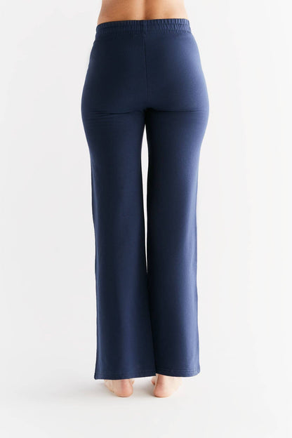 Model wearing Luxury Eco-Friendly Tencel Women’s Sweatpants, demonstrating the flattering fit and premium comfort of the organic cotton blend.