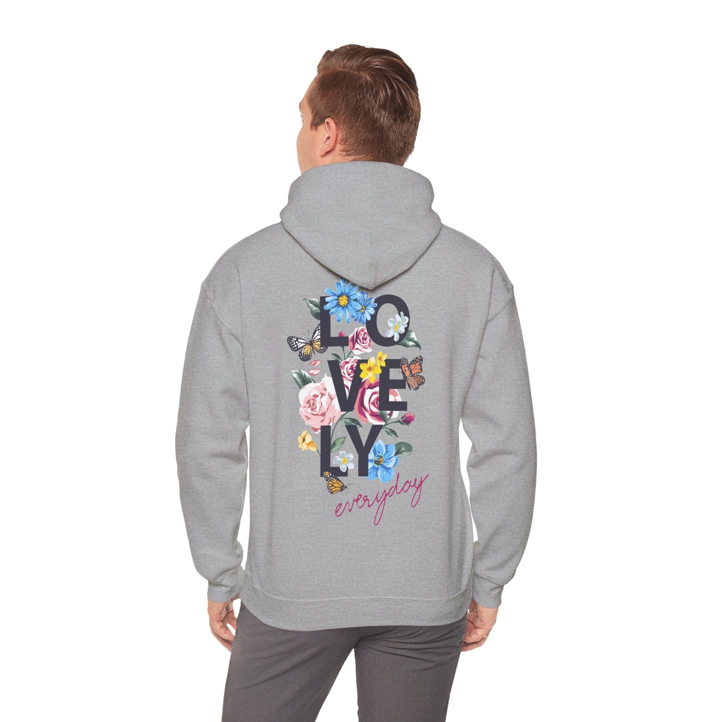 Trendy grey hoodie for men featuring a vibrant floral back graphic with the word 'LOVELY' in bold dark grey letters and 'everyday' in elegant cursive, showcasing a blend of roses and daisies for a luxurious casual style.