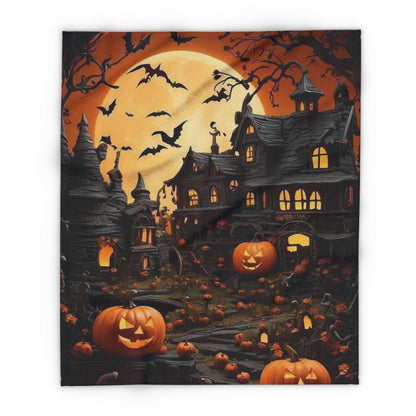 Decorative and Warm Halloween Spooky Arctic Fleece Blanket featuring a haunted house illuminated by a glowing full moon, surrounded by bats and carved pumpkins, perfect for adding a luxurious seasonal touch to your home.