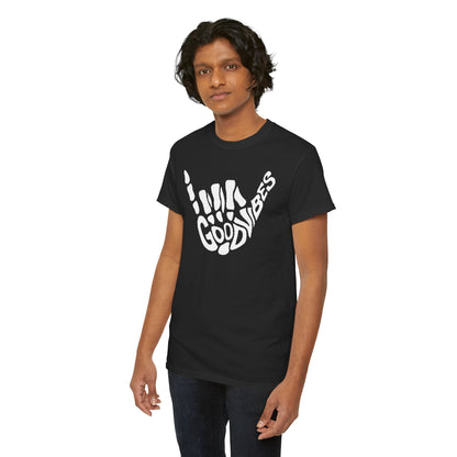 Trendy black men's T-shirt featuring a dynamic skeletal hand and 'GOOD VIBES' text, worn by a young man exuding confidence, ideal for a fashionable urban look.
