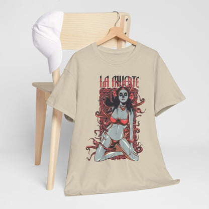 Luxurious La Muerte Graphic T-Shirt showcased on a wooden chair, accompanied by a stylish cap, featuring an intricate sugar skull design that embodies elegance and cultural homage.