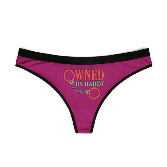 Elegant women's thong featuring a bold 'Owned By Daddy' text with handcuff graphic, designed in rich pink fabric, ideal for playful intimacy and special celebrations.