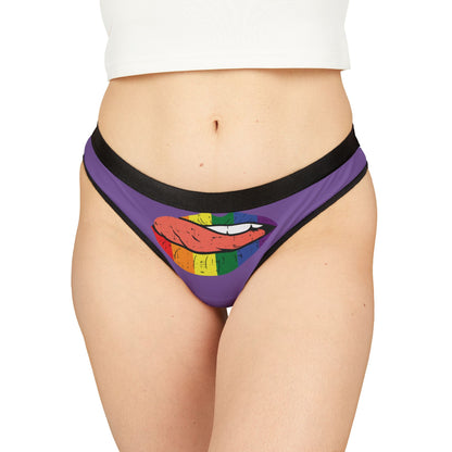 Luxurious women's thong featuring a bold graphic design of rainbow lips, set against a purple background, symbolising playful romance and cheeky style.