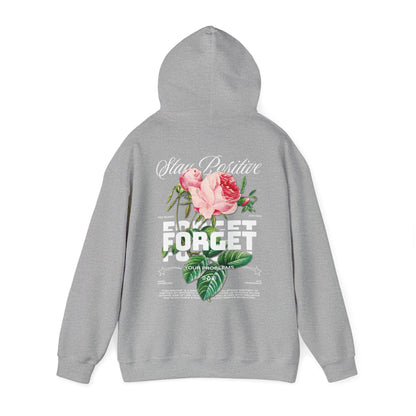 Stylish grey hoodie featuring a motivational floral design with phrases 'Stay Positive' and 'Forget Your Problems', embodying a blend of art and positivity.