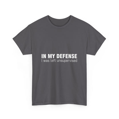 Chic dark grey unisex cotton graphic t-shirt displaying 'In My Defence I Was Left Unsupervised' for a trendy and artistic vibe.