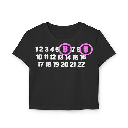 Chic black cropped t-shirt exuding sophistication with a whimsical number display, highlighting 6 and 9 in vibrant light purple circles.