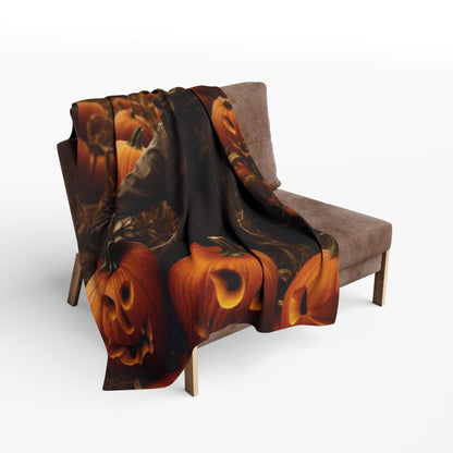 Luxurious Decorative and Warm Halloween Spooky Arctic Fleece Blanket elegantly draped over a stylish chair, featuring vivid jack-o'-lantern designs, perfect for festive autumn evenings.