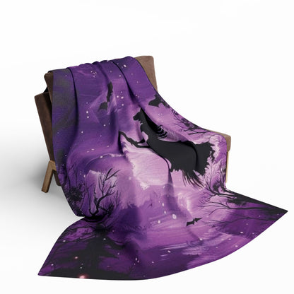 Decorative and Warm Halloween Spooky Arctic Fleece Blanket gracefully cascading over furniture, adorned with striking Halloween imagery, perfect for luxe autumn comfort.