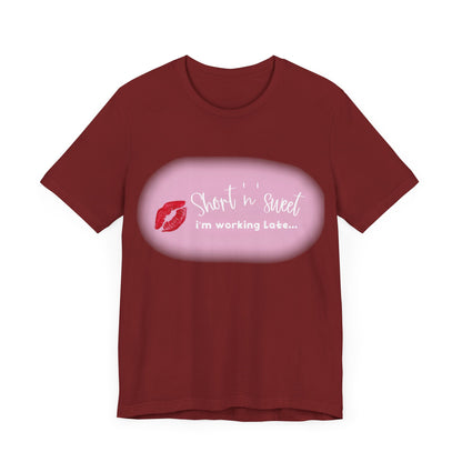 Maroon Sabrina Carpenter Inspired Unisex Short Sleeve Tee with vibrant lipstick print and playful text, an exquisite expression of individuality.