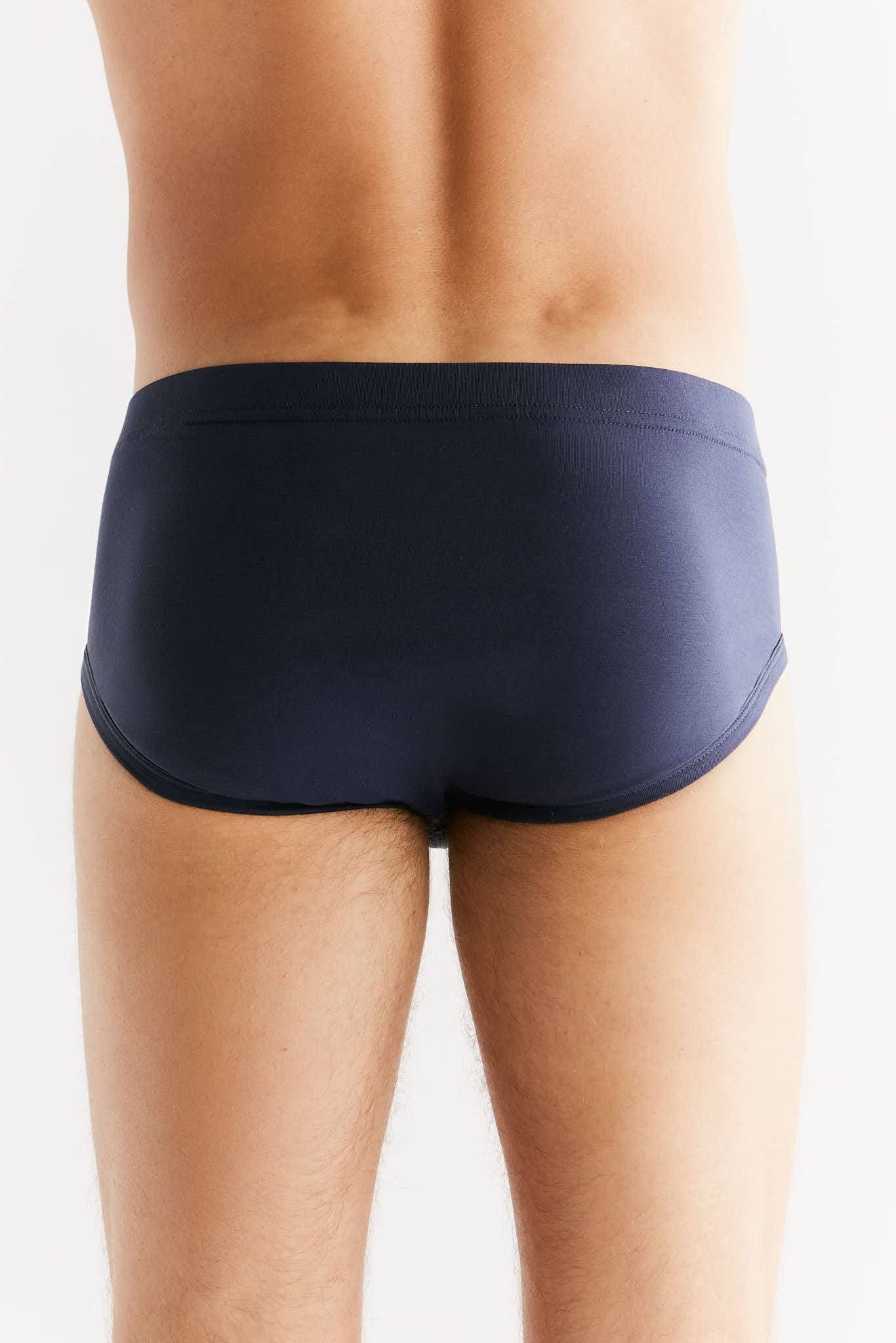 Luxury organic cotton men's briefs featuring a comfortable sewn-in elastic waistband, perfect for eco-conscious consumers.