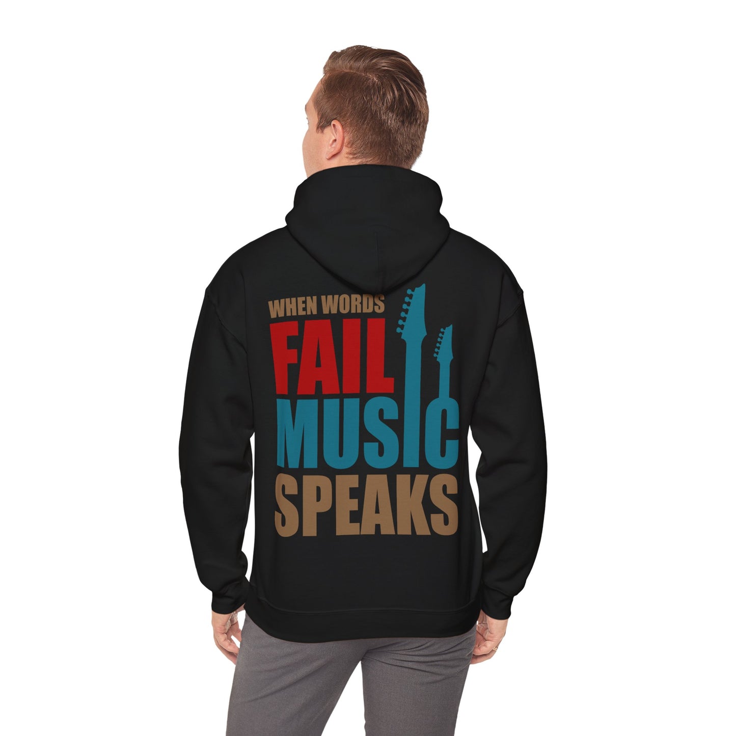 Stylish black hoodie worn by a model, featuring the bold phrase 'When Words Fail Music Speaks' alongside guitar silhouettes, perfect for music lovers.