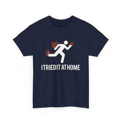 Luxury navy men's t-shirt featuring a spirited stick figure running with flames, paired with the inspiring text 'I TRIED IT AT HOME'.