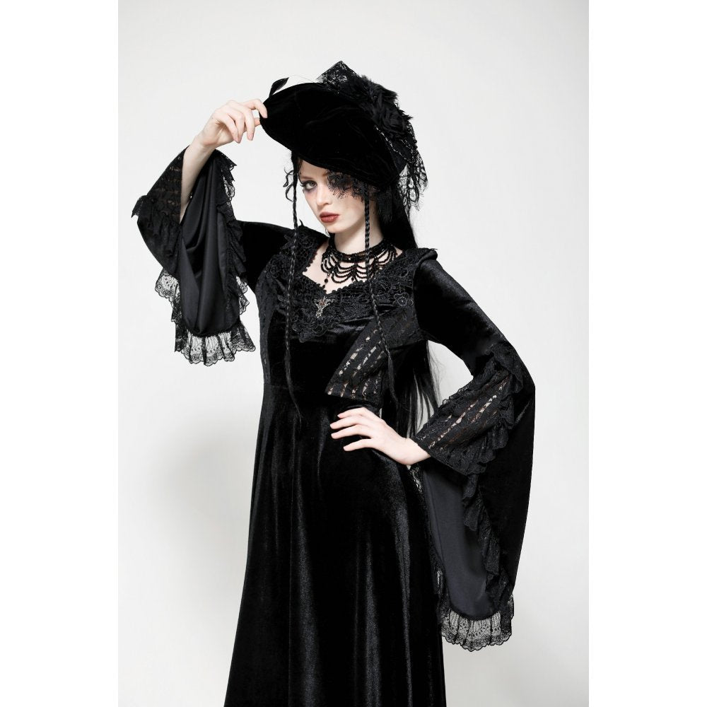 Full body shot of the Dark In Love Petricka Velvet Maxi Dress, showcasing its flowing silhouette and sweetheart neckline in a moody gothic setting.