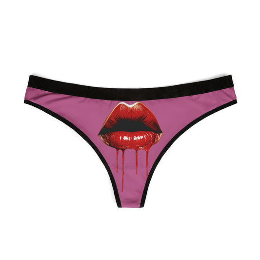 Elegant Cheeky Women's Thong displaying a striking design of red lips with a dripping effect on a soft pink background, perfect for adding whimsy to intimate apparel.