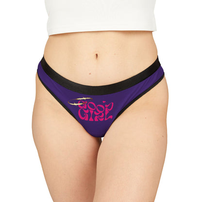 Luxurious ‘Good Girl’ thong panties in vibrant purple featuring bold pink lettering and a delicate halo design, showcased elegantly on a model.