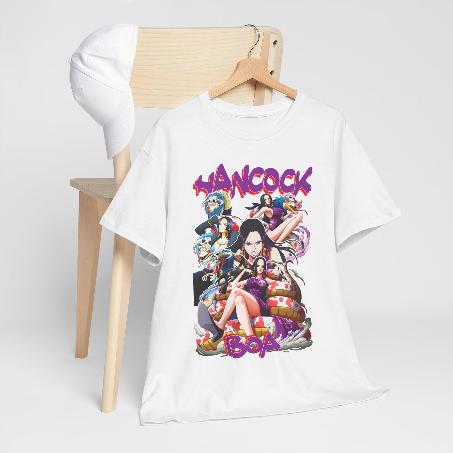 Chic Boa Hancock t-shirt artistically placed on a wooden chair alongside a stylish cap, presenting a vibrant, eye-catching anime graphic that captures the essence of elegance in fandom.