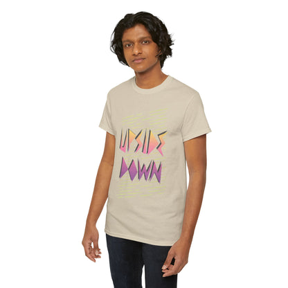 Fashionable young man wearing a chic t-shirt adorned with the 'UPSIDE DOWN' design, set against a clean, bright backdrop.