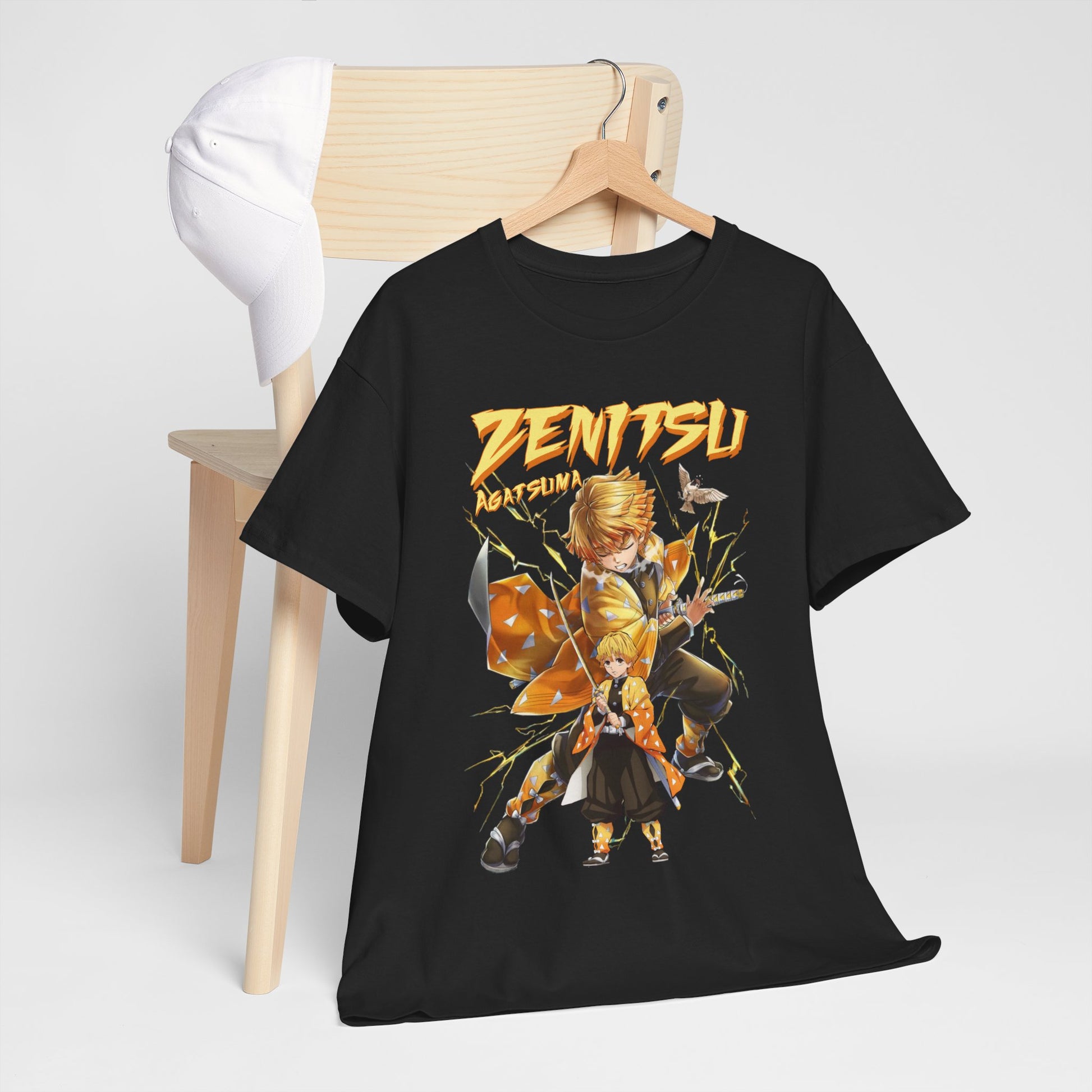 Chic Zenitsu Agatsuma t-shirt styled on a wooden chair, paired with a cap, representing a trendy casual outfit.