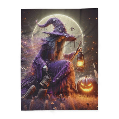 High-quality Decorative and Warm Halloween Spooky Arctic Fleece Blanket featuring a stylish witch in a stunning purple outfit with a lantern and jack-o'-lantern, designed to enhance the cosy ambiance of Halloween celebrations.