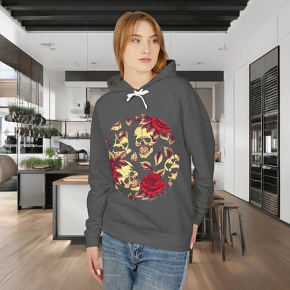 A model wearing a stylish Unisex Lightweight Hooded Sweatshirt adorned with a striking skull and roses design, set in a modern kitchen environment for a luxurious lifestyle appeal.