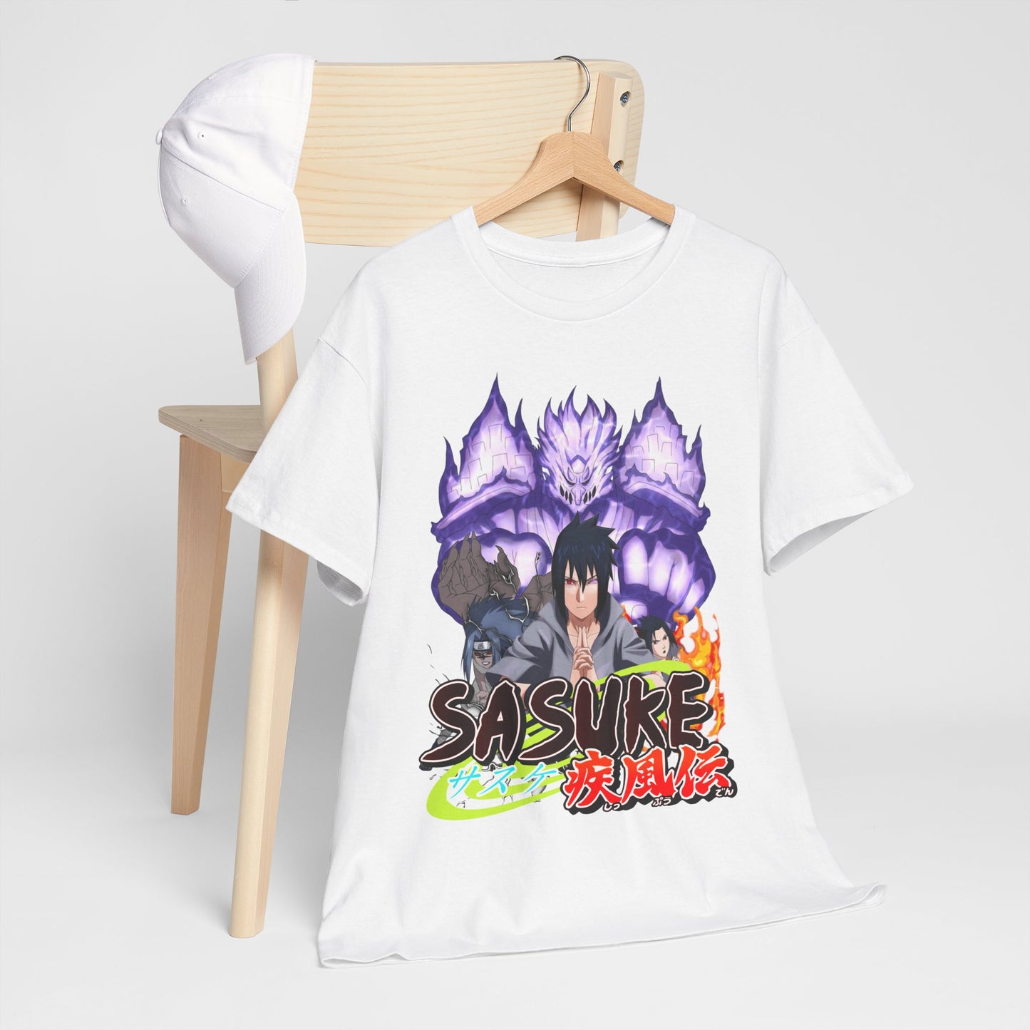 Elegant Sasuke graphic tee displayed on a wooden chair with a cap, showcasing a bold illustration of the character, ideal for casual sophistication and anime passion.