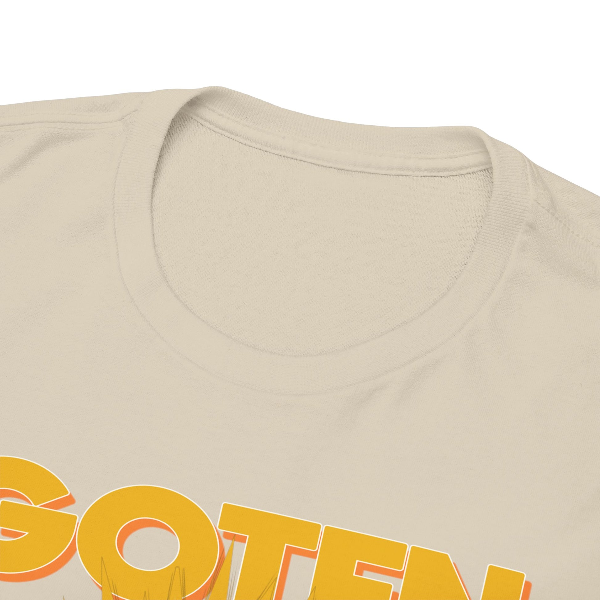 Close-up of a luxurious beige T-shirt neckline featuring GOTEN lettering, illustrating premium fabric and meticulous craftsmanship, ideal for anime fashion.