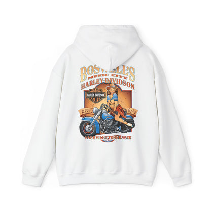 Elegant white hoodie featuring a vintage-inspired illustration of a confident pin-up woman on a classic blue motorcycle, adorned with 'Boswell's Music City' and 'Harley-Davidson' branding, perfect for adding a touch of luxury to any casual outfit.