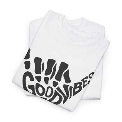 Sumptuous white t-shirts stacked elegantly, each displaying a striking skeletal hand design with 'GOOD VIBES' in a modern, artistic font.