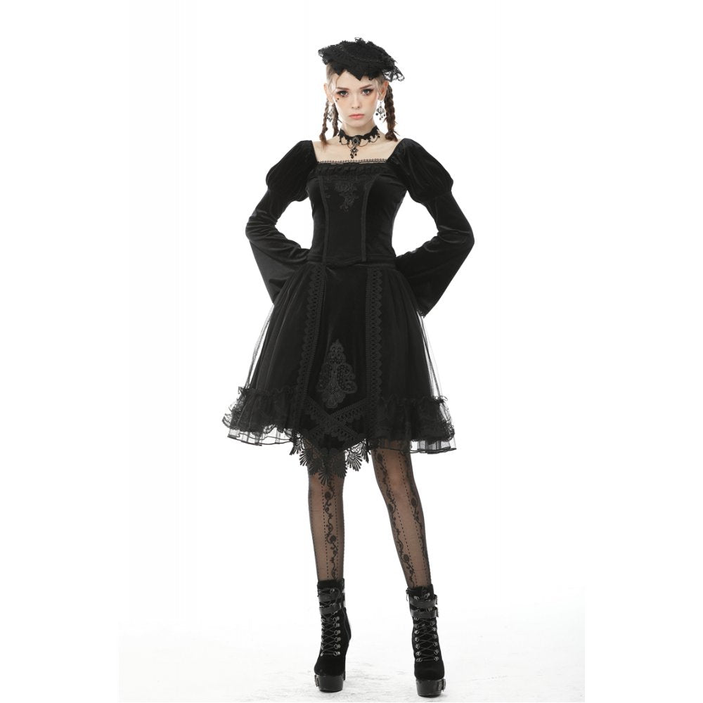 Model wearing the Dark in Love Melisandre embroidered velvet skirt in a gothic setting, accentuating its dramatic silhouette and asymmetrical design.