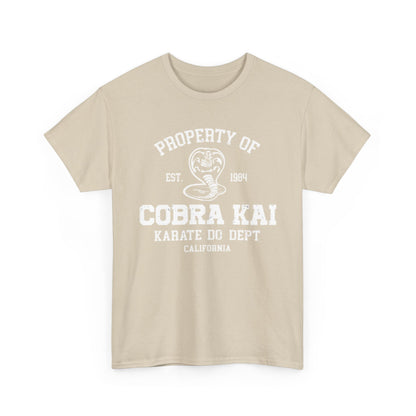 Sophisticated Cobra Kai T-shirt design displaying the vintage logo 'Property of Cobra Kai Karate Do Dept' on a refined beige fabric.