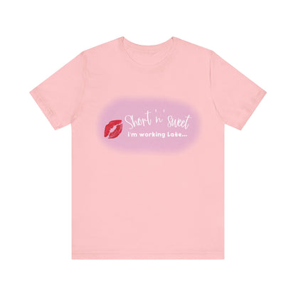 Sabrina Carpenter Inspired Unisex Short Sleeve Tee presented in a delicate light pink colour featuring a striking lipstick print, ideal for music lovers and style connoisseurs.