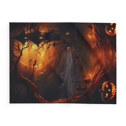 Decorative and Warm Halloween Spooky Arctic Fleece Blanket showcasing a captivating scene with bats flying over a spooky landscape, adorned with vibrant Halloween pumpkins.