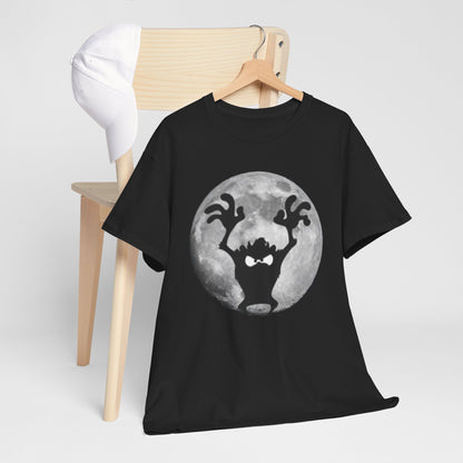 Elegant black graphic t-shirt featuring Taz the Tasmanian Devil silhouetted against a full, textured grey moon, displayed on a minimalist wooden chair with a matching cap.