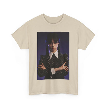 Unisex graphic tee shirt in beige featuring 'Wednesday: Embrace the Dark Elegance!' design, displaying the iconic character in gothic attire against a moody backdrop.