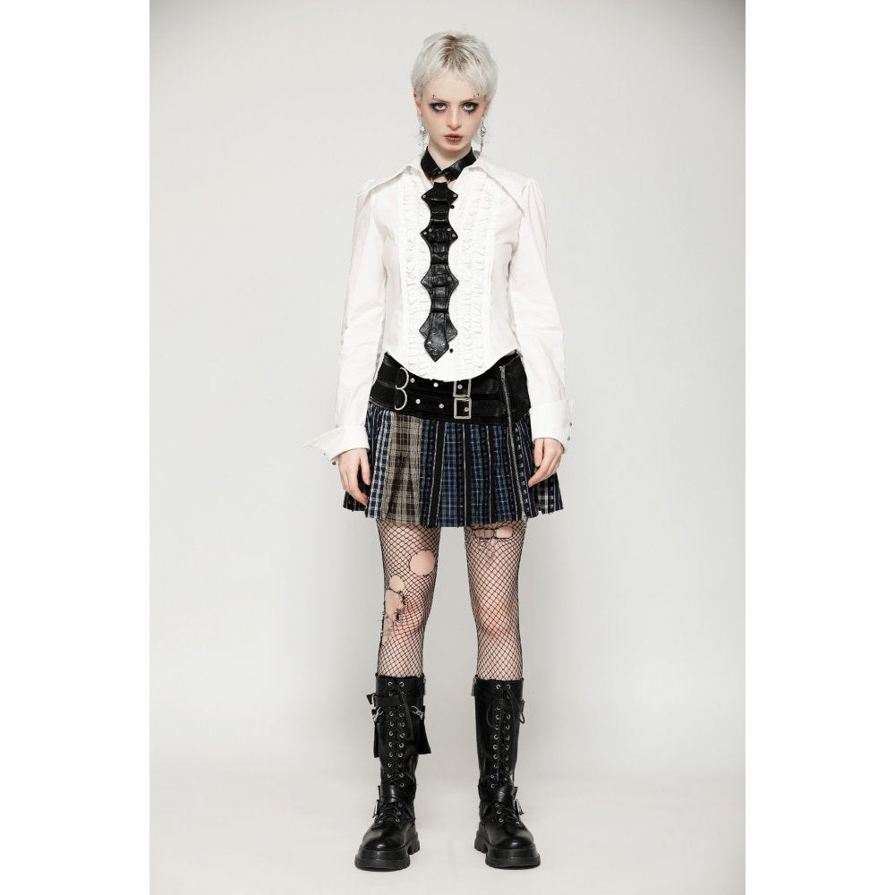 Close-up view of the Dark In Love patchwork leather-waist mini skirt highlighting the intricate plaid details and rebellious faux buckle design.