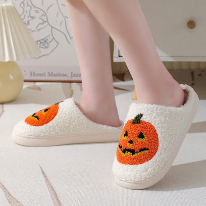Elegant Halloween Pumpkin Cartoon Slippers in white, adorned with a cheerful pumpkin pattern, perfect for couples wanting to enjoy Halloween in luxurious comfort.