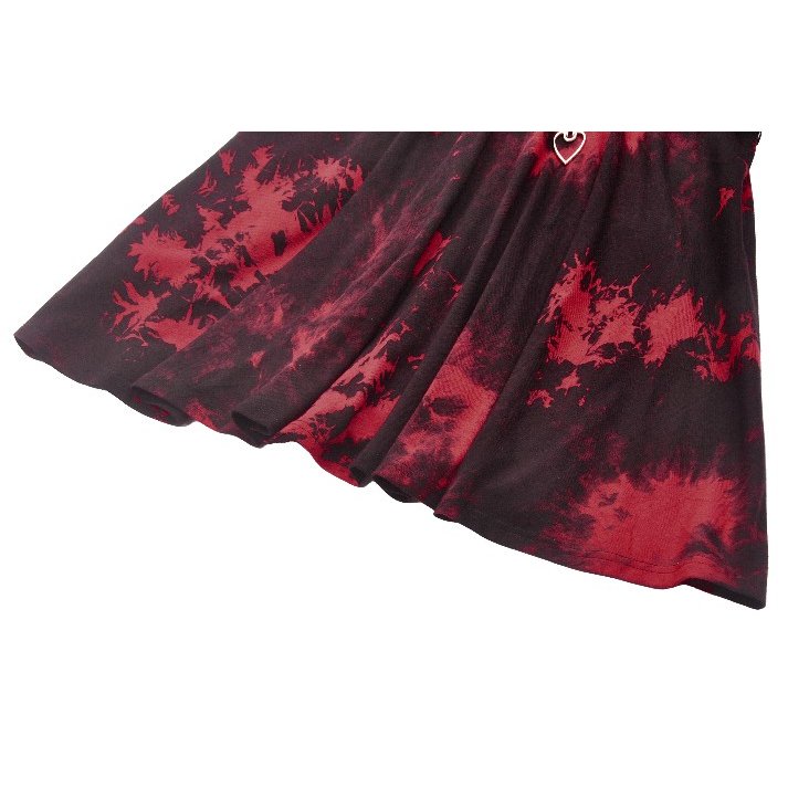 Close-up of the Dark in Love Bellatrix Dress details, highlighting the sheer fishnet panel and off-centre zipper accent.