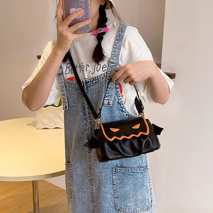 Versatile PU Crossbody Bags for Women - Trendy Orange & Black Halloween Style, presented on a model wearing denim overalls, showcasing the black version of the bag.