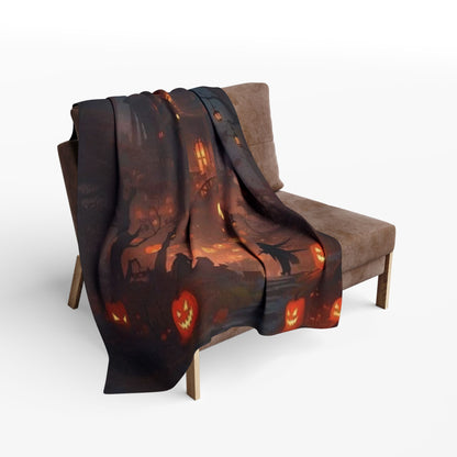 The decorative and warm Halloween spooky Arctic fleece blanket drapes elegantly over a stylish armchair, featuring a rich Halloween design with jack-o'-lanterns.