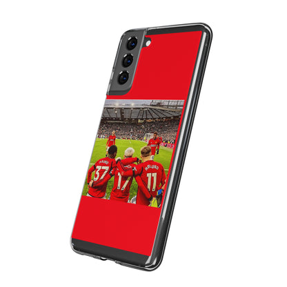 Artful Manchester United Mainoo Garnach Hojlund Soft Phone Case angled elegantly, portraying a vibrant scene of team camaraderie in the heart of the stadium.