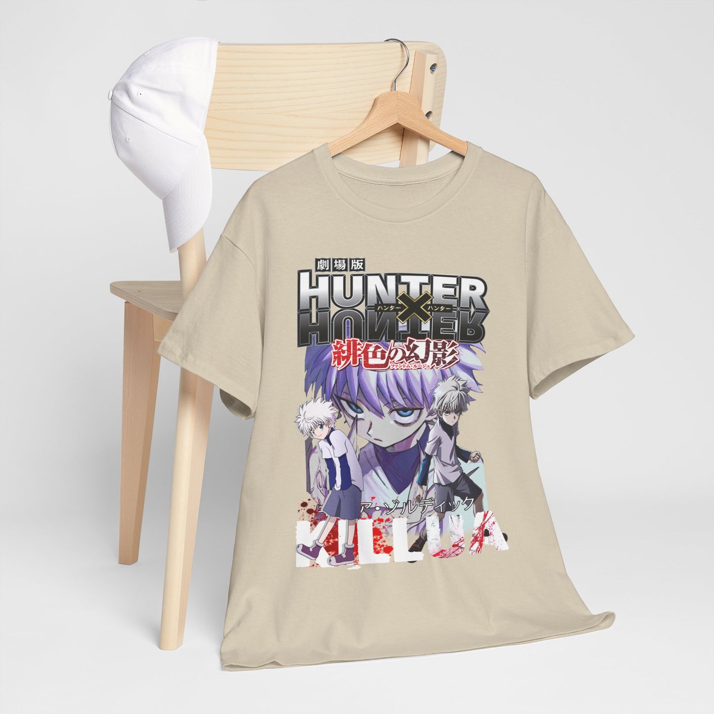 Sophisticated display of a Hunter x Hunter graphic tee on a wooden chair, paired with a stylish cap, capturing a trendy lifestyle.