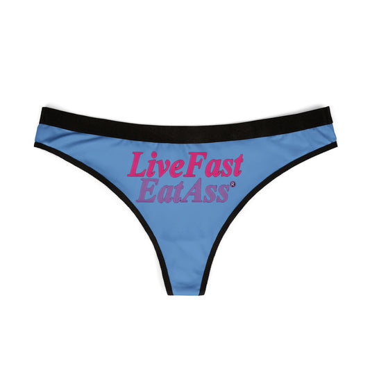 Elegant blue thong panties displaying the bold phrase 'Live Fast Eat Ass', perfect for expressing confidence and luxury.